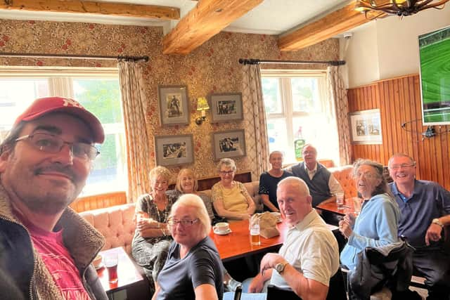 A picture of a group monthly meeting at the Lynchgate