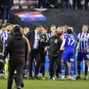 Shaun Maloney attempts to calm down opposite number Ian Evatt after Latics' 1-0 victory over Bolton