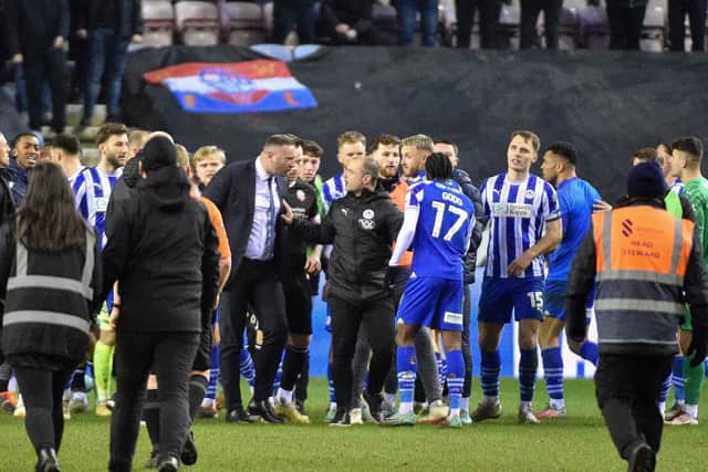 Shaun Maloney attempts to calm down opposite number Ian Evatt after Latics' 1-0 victory over Bolton