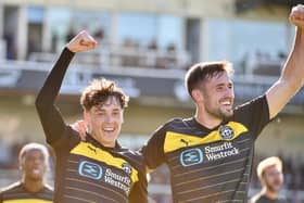 James Carragher celebrates goal number four with scorer Luke Chambers