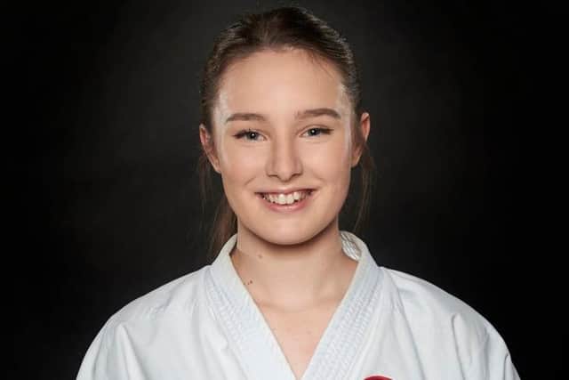 Grace Baron in her karate uniform (properly called a gi)