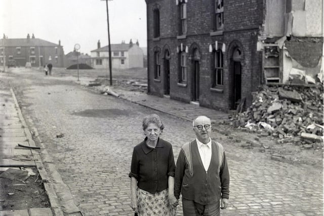 Retro 1968 - Pensioners Mr and Mrs Sweeney take a last stroll down Anderton Street in Scholes, Wigan, before their home is demolished.