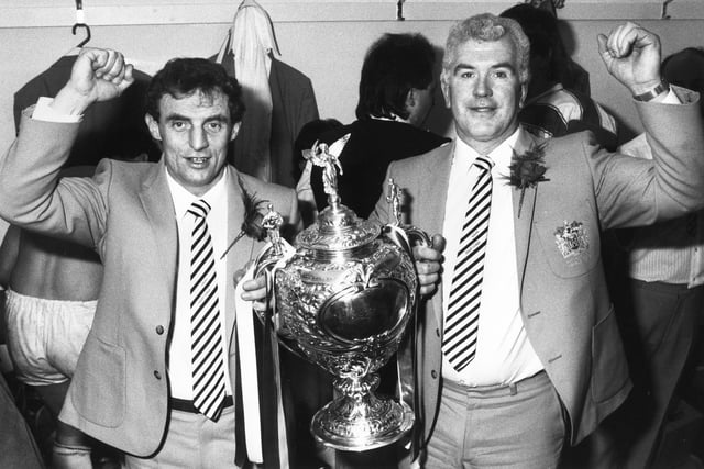 Triumphant Wigan joint coaches Alan McInnes, left, and Colin Clarke with the Challenge Cup in the Wembley dressing room.