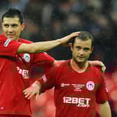 Antolin Alcaraz celebrates winning the FA Cup semi-final in 2013 with Shaun Maloney