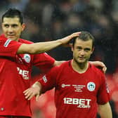 Antolin Alcaraz celebrates winning the FA Cup semi-final in 2013 with Shaun Maloney