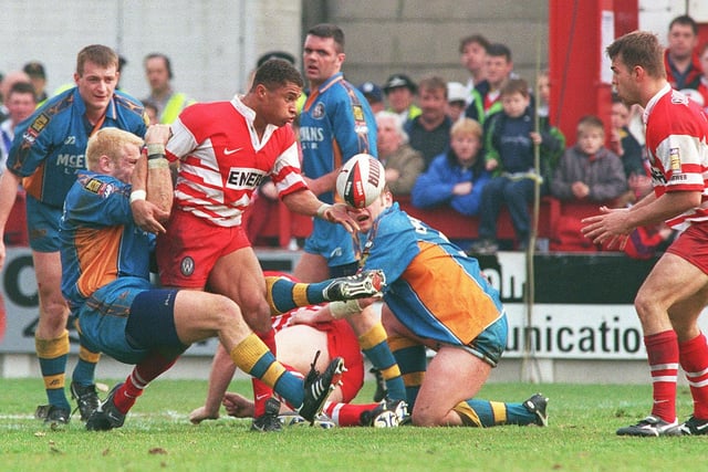 WIGAN WARRIORS V ST HELENS - LAST GOOD FRIDAY DERBY AT CENTRAL PARK.
Jason Robinson gets the ball away to Gary Connolly.