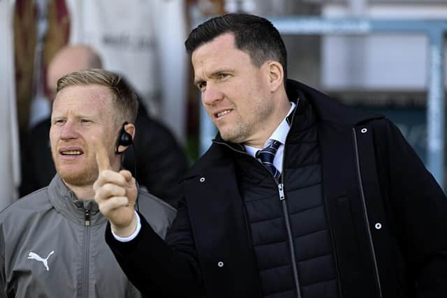 Gary Caldwell and David Perkins have returned to Exeter City for more backroom reinforcements
