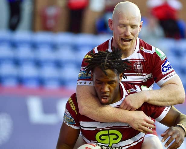 Liam Farrell congratulates Junior Nsemba after the opening try of the game
