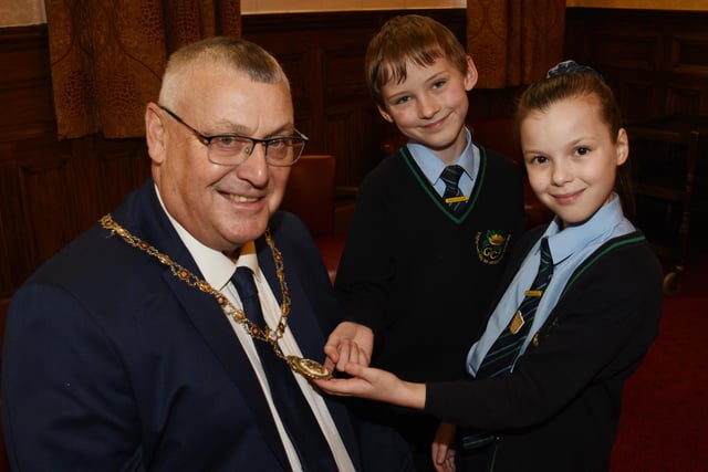 The Mayor's consort Coun Clive Morgan with pupils who take an interest in his Mayoral chains.