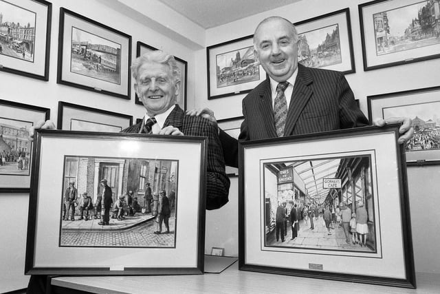Wigan artist Harry Walder, left, with bookshop owner Syd Smith and some of the original art owned by Syd in November 1990.
Prints of Harry's work were sold in Syd's Mesnes Street shop. 