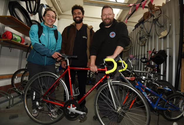 Mark Harrison, right, director at Wigan Cycle Project, with Ellen Holme and Ben Porter
