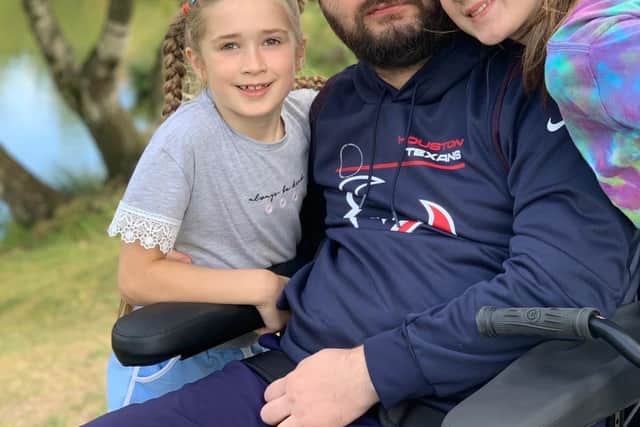 Darren with his two daughters after his stroke