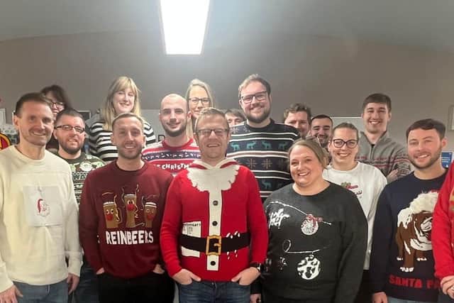 Staff from In Professional Development don their Christmas jumpers