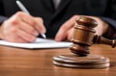 A trial was scheduled for July 2026