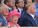 (L-R) Britain's Prince Charles, Prince of Wales, Britain's Queen Elizabeth II and US President Donald Trump look up as aircraft perform a fly-over during an event to commemorate the 75th anniversary of the D-Day landings, in Portsmouth, southern England, on June 5, 2019. - US President Donald Trump, Queen Elizabeth II and 300 veterans are to gather on the south coast of England on Wednesday for a poignant ceremony marking the 75th anniversary of D-Day. Other world leaders will join them in Portsmouth for Britain's national event to commemorate the Allied invasion of the Normandy beaches in France -- one of the turning points of World War II. (Photo by Daniel LEAL-OLIVAS / AFP)        (Photo credit should read DANIEL LEAL-OLIVAS/AFP/Getty Images)
