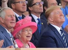 (L-R) Britain's Prince Charles, Prince of Wales, Britain's Queen Elizabeth II and US President Donald Trump look up as aircraft perform a fly-over during an event to commemorate the 75th anniversary of the D-Day landings, in Portsmouth, southern England, on June 5, 2019. - US President Donald Trump, Queen Elizabeth II and 300 veterans are to gather on the south coast of England on Wednesday for a poignant ceremony marking the 75th anniversary of D-Day. Other world leaders will join them in Portsmouth for Britain's national event to commemorate the Allied invasion of the Normandy beaches in France -- one of the turning points of World War II. (Photo by Daniel LEAL-OLIVAS / AFP)        (Photo credit should read DANIEL LEAL-OLIVAS/AFP/Getty Images)