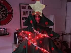 Tony Taylor pictured in a Christmas tree fancy dress outfit that he will wear for the charity walk.