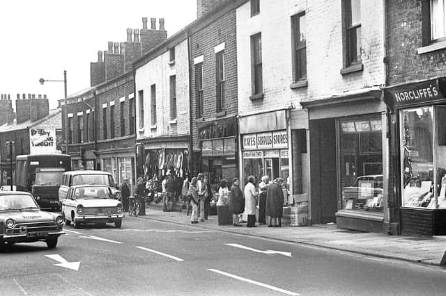 Darlington Street with Kaye's Surplus Stores and Norcliffe's Corsets prominent in July 1973.Norcliffe's shop at Number 22 was a tripe shop in the 1930s and where George Orwell stayed whilst researching for his book "The Road to Wigan Pier".