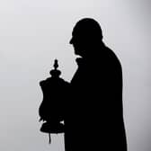 The statue of Dave Whelan with the FA Cup