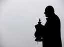 The statue of Dave Whelan with the FA Cup