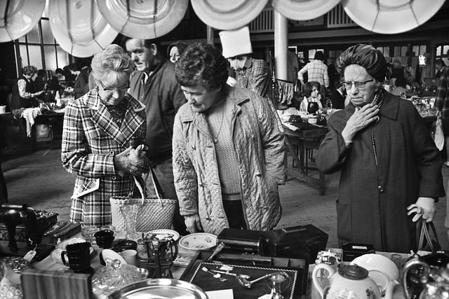 Browsing the stalls at a flea market in the Queen's Hall, Wigan, on Saturday 24th of May 1975.