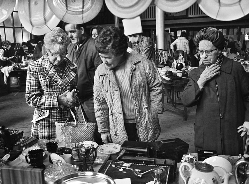 Browsing the stalls at a flea market in the Queen's Hall, Wigan, on Saturday 24th of May 1975.