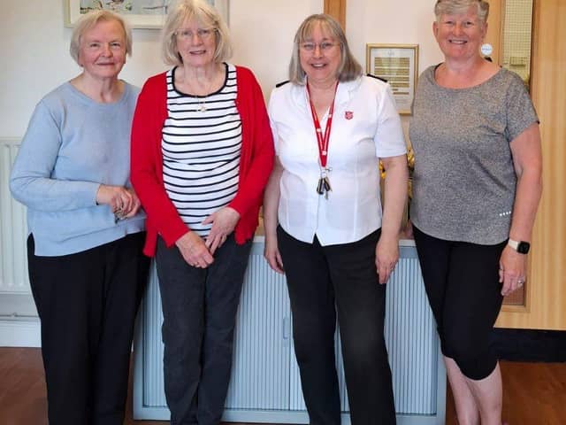 Volunteers with church leader of The Salvation Army in Ashton-in-Makerfield, Elaine Rogers