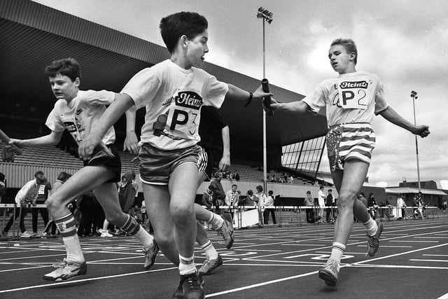 Deanery High School pupils exchange the baton during the Heinz schools marathon relays at Robin Park Stadium on Thursday 20th of April 1989.
47 schools took part and cash prizes were shared between the schools and the Spinal Injuries Association.
