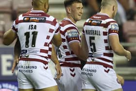 Wigan Warriors take on Leeds Rhinos for a place in the Grand Final