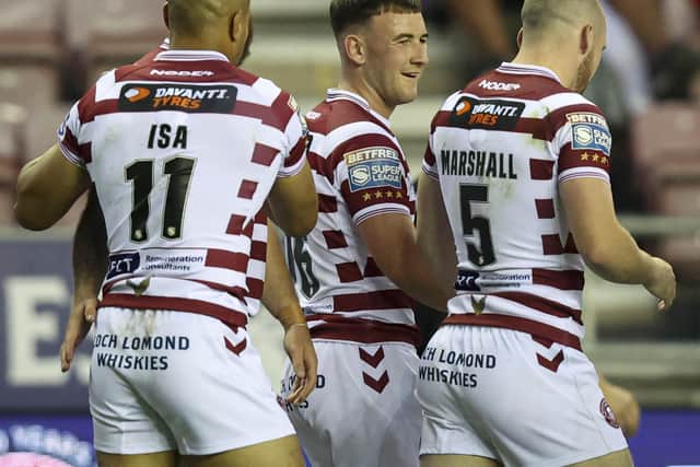 Wigan Warriors take on Leeds Rhinos for a place in the Grand Final
