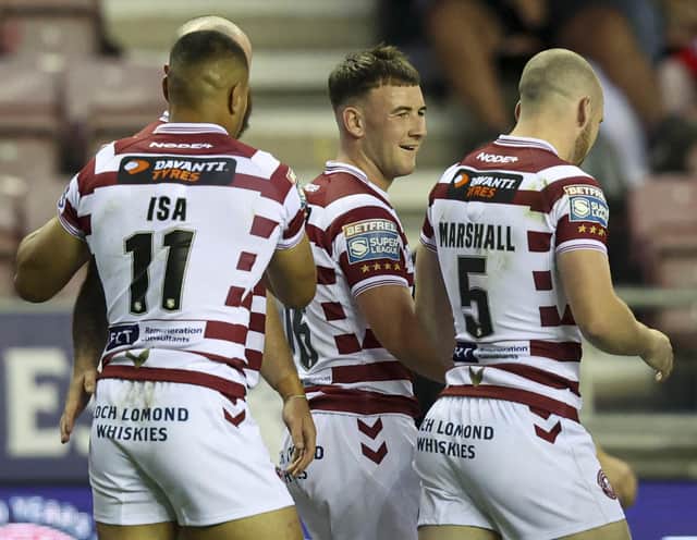 Wigan Warriors take on Leeds Rhinos for a place in the Grand Final