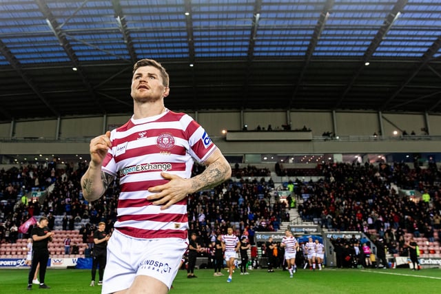 The teams run out ahead of the game between Wigan Warriors and Hull FC.