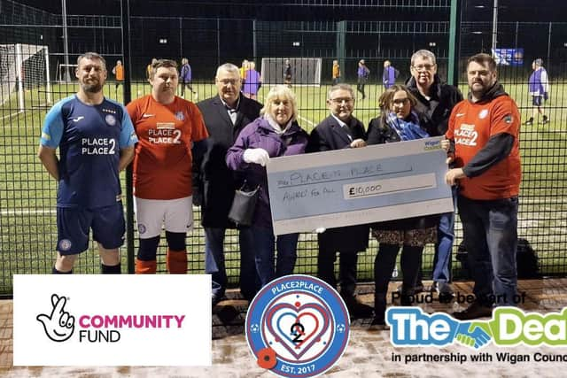 Peter Hill (right) and members of Place 2 Place were joined by councillors including Chris Ready to celebrate their duccessful lottery bid.