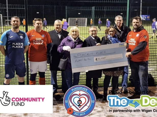 Peter Hill (right) and members of Place 2 Place were joined by councillors including Chris Ready to celebrate their duccessful lottery bid.