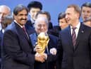 FIFA President Joseph Blatter is flanked by Russian Deputy Prime Minister Igor Shuvalov (right) and Sheikh Hamad bin Khalifa Al-Thani, Emir of Qatar, after the announcement that Russia host the 2018 World Cup and Qatar the 2022 World Cup back in 2010 (credit AP Photo/Michael Probst)
