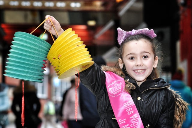 Nine-year-old Lilly Johnson marks Chinese New Year by making lanterns at Makinson Arcade, Wigan
