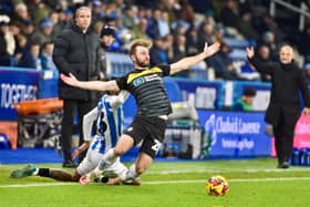 Shaun Maloney watches Callum McManaman get taken down during Latics' 1-0 defeat at Huddersfield