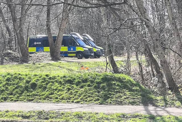 Police vans parked off Scot Lane, one of the areas where teams have been searching for Darren Orme