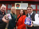 Antony Winnard, left, and John Winnard, right, owners of William Santus and Co the makers of Uncle Joe's Mint Balls, with the Tommy Tins, created to celebrate the 75th Anniversary of VE Day, with a percentage of each sale donated to charity.  Here they present £400 to The Armed Forces Community Hub, Wigan, represented by Armed Forces key worker Gillian Burchall and Hub managing director Laura Ingham, second from right.