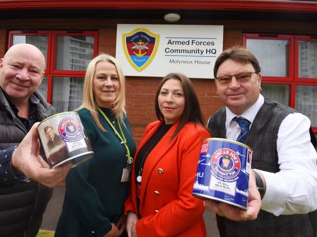 Antony Winnard, left, and John Winnard, right, owners of William Santus and Co the makers of Uncle Joe's Mint Balls, with the Tommy Tins, created to celebrate the 75th Anniversary of VE Day, with a percentage of each sale donated to charity.  Here they present £400 to The Armed Forces Community Hub, Wigan, represented by Armed Forces key worker Gillian Burchall and Hub managing director Laura Ingham, second from right.