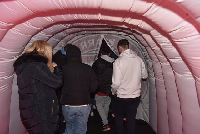 Wigan supporters enter the fan zone.