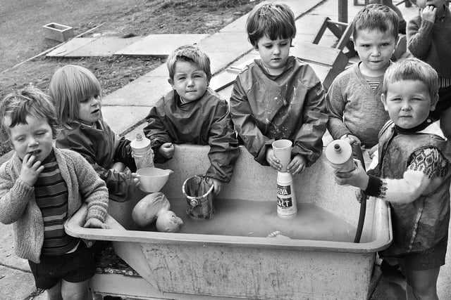 Water play for under 5's at the Pemberton Primary School nursery school building in Severn Drive, Norley Hall, in September 1971.