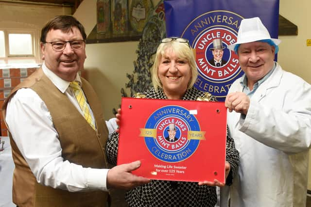 The Mayor of Wigan Coun Marie Morgan, centre, with John Winnard, left, and Antony Winnard, right, joint managing directors of Wm Santus and Co as they celebrate the firm's 125th anniversary.