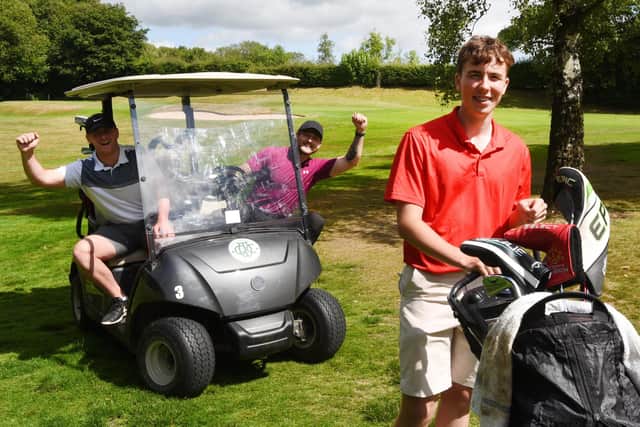 WIGAN - 14-07-22  Wigan Warriors players Harry Smith, left, and Joe Shorrocks, showed their support and joined Ethan Prior, 16, for a round, during his charity golf challenge, 100 holes in one day, at Wigan Golf Club, where he is junior captain, raising funds for Derian House childrens hospice.