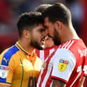 Sam Morsy gets up close and personal with Yoann Barbet of Brentford during a Championship match in September 2018