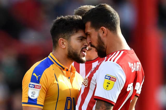 Sam Morsy gets up close and personal with Yoann Barbet of Brentford during a Championship match in September 2018