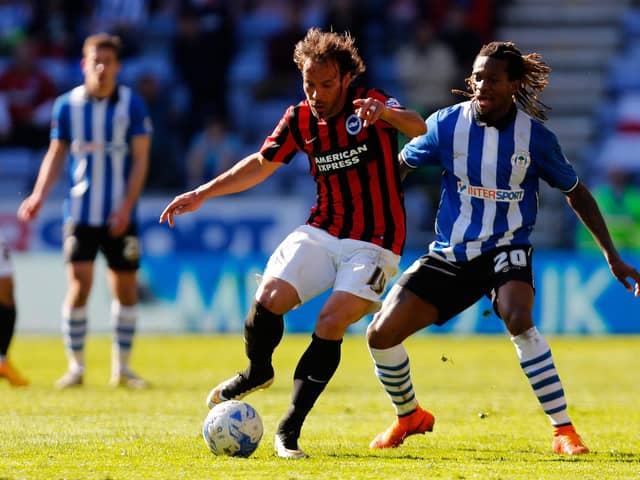 Inigo Calderon in action during his Brighton playing days, doing battle with Latics icon Gaetan Bong in April 2015