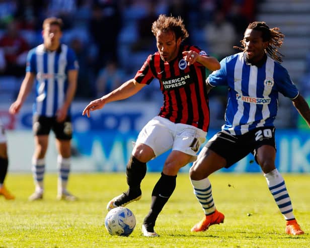 Inigo Calderon in action during his Brighton playing days, doing battle with Latics icon Gaetan Bong in April 2015