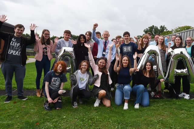 A-Level results day 2022 - Students celebrate A-Level results at St John Rigby College, Orrell.