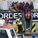 A group of people thought to be migrants are brought in to Dover, Kent, following a small boat incident in the Channel